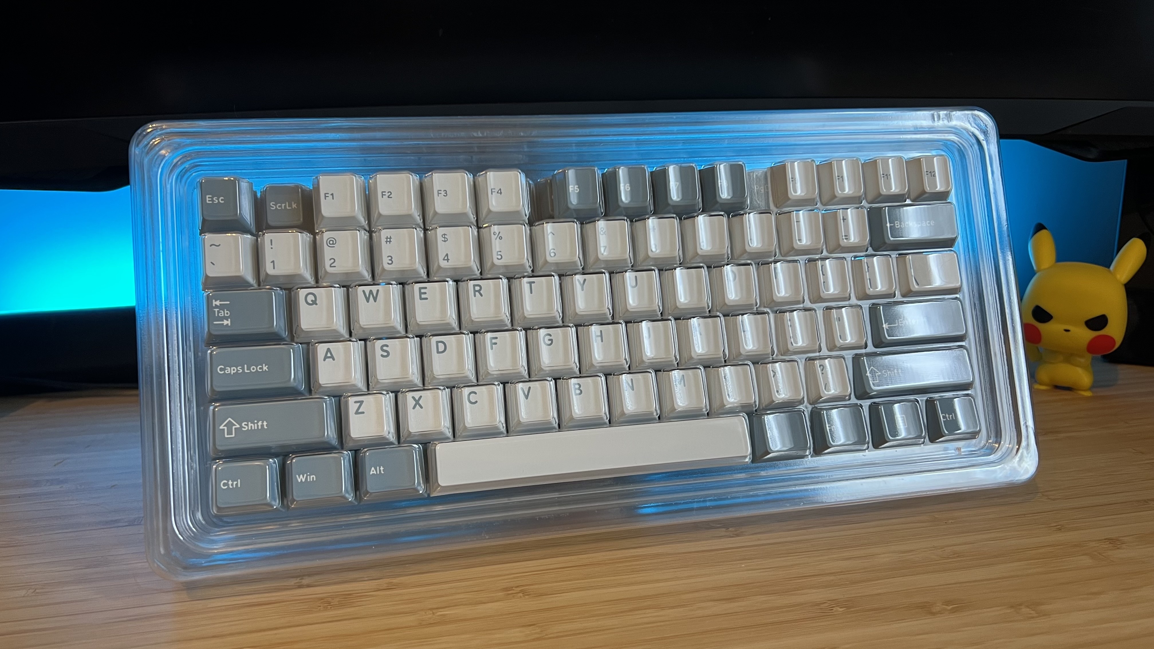 Ghost Judge keycap set on wooden desk with blue backlighting