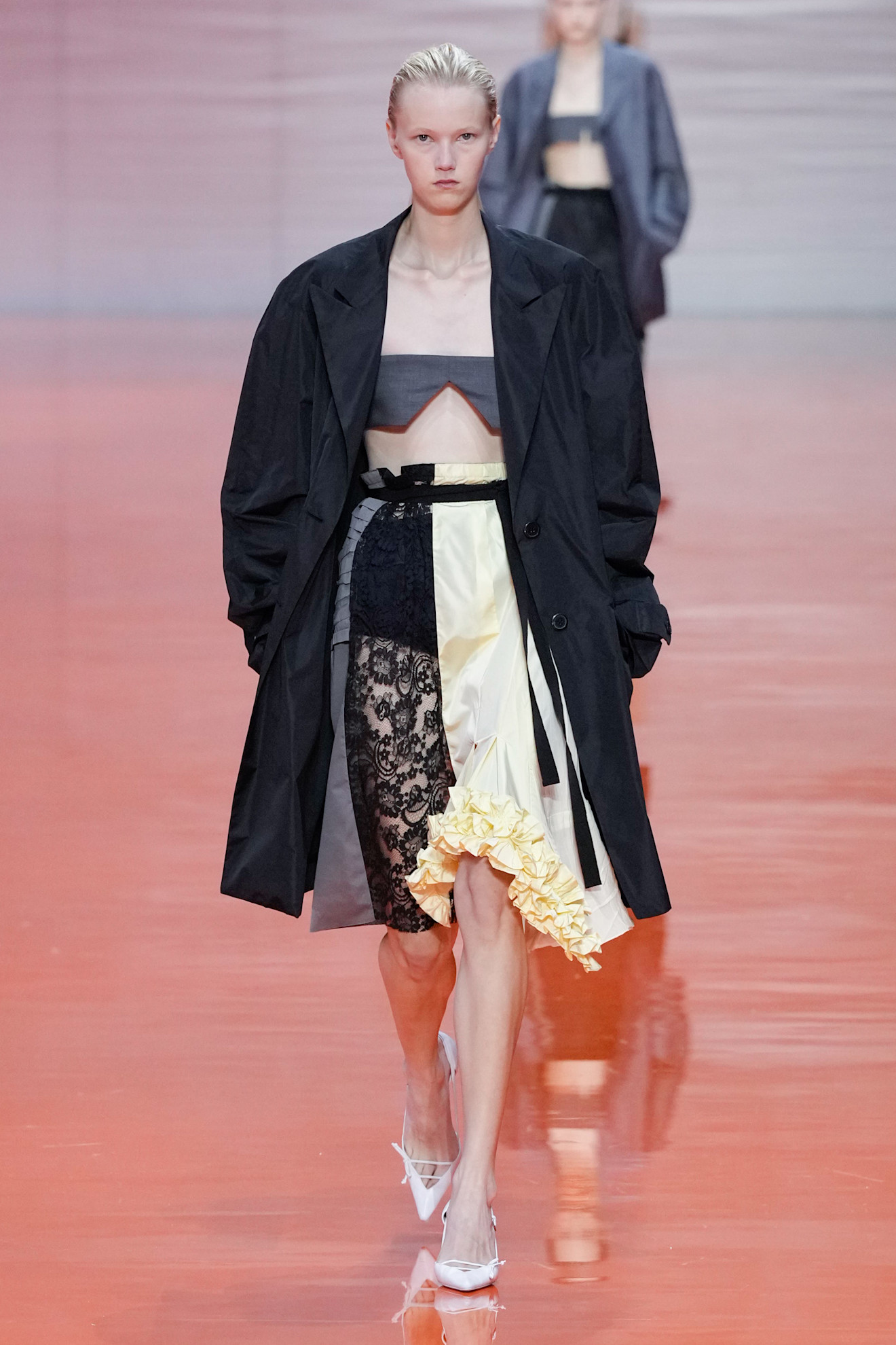 A Prada model wearing a Frankenstein skirt in the S/S 26 show.