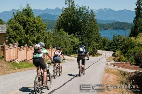 Racers get a road section to break up the singletrack.