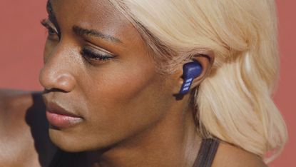 Adidas Z.N.E 01 ANC review: woman wearing earbuds