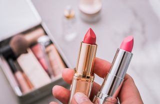 two lipsticks with the caps off