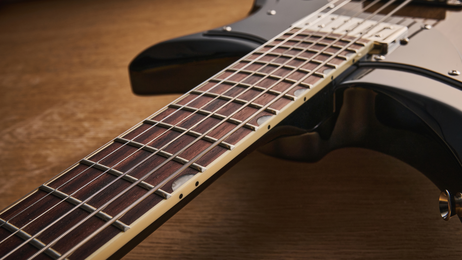 Gretsch Electromatic CVT Baritone in Bristol Fog brown sunburst finish shot on wood.