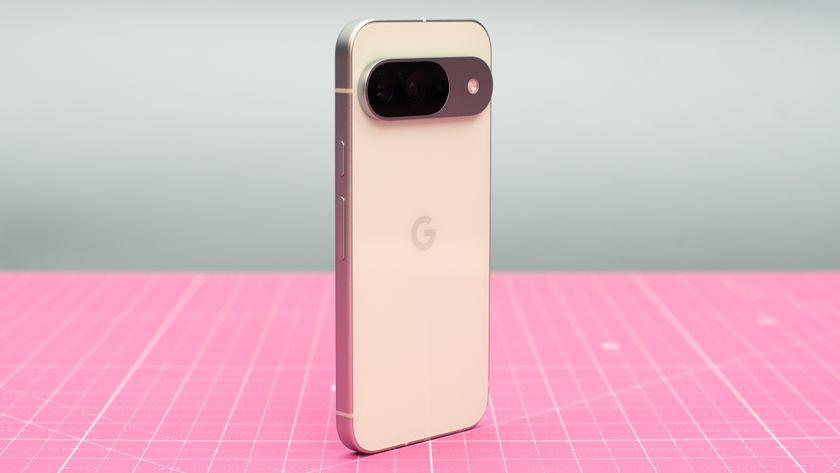 Google Pixel 9 in green Wintergreen color showing AI features on screen