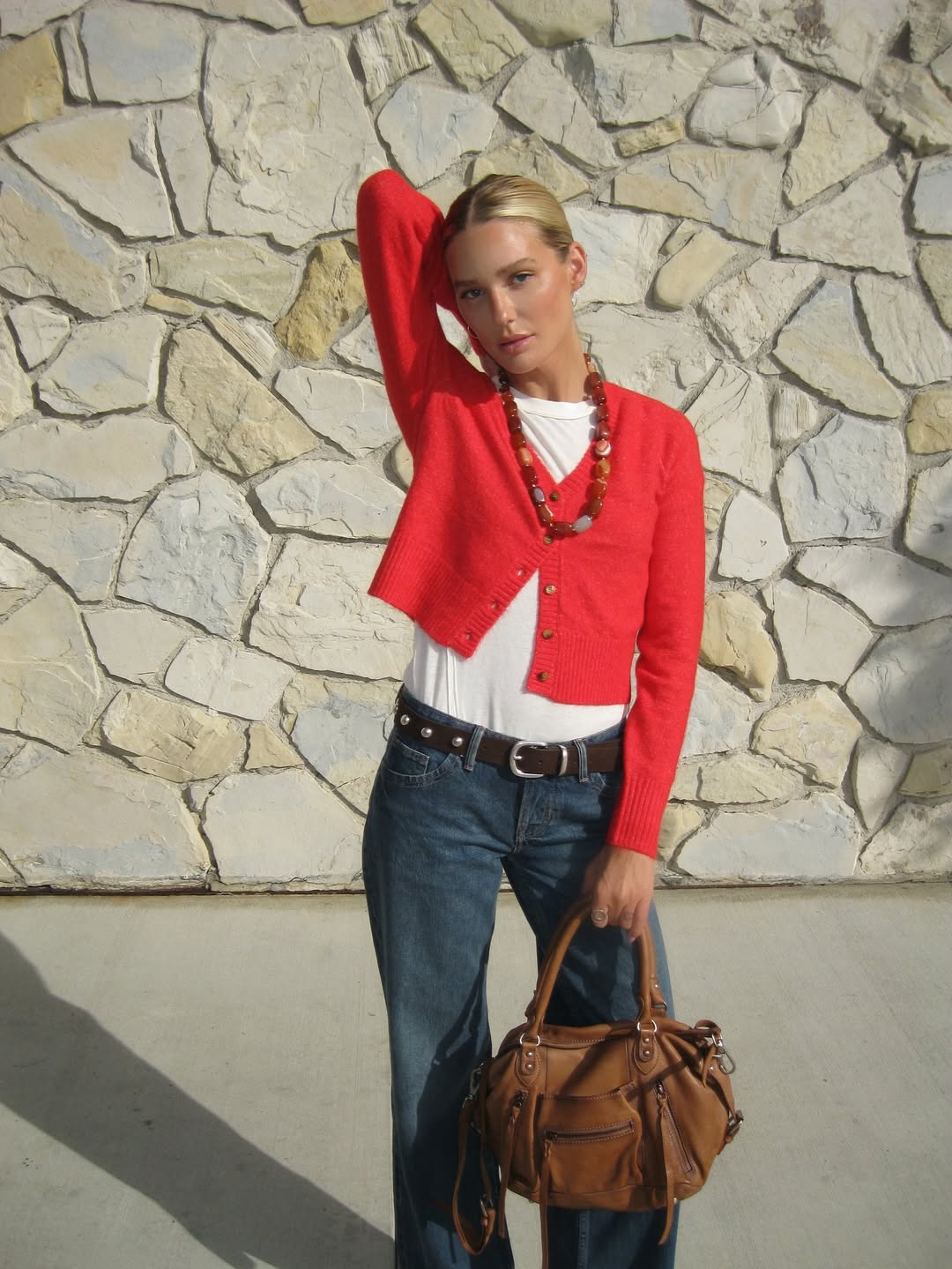 Megan Adelaide in a red cardigan