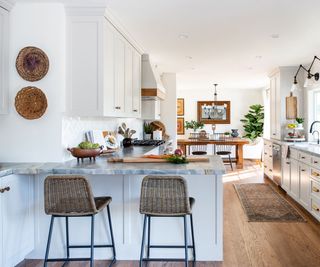 Light gray peninsula in modern kitchen with white chair