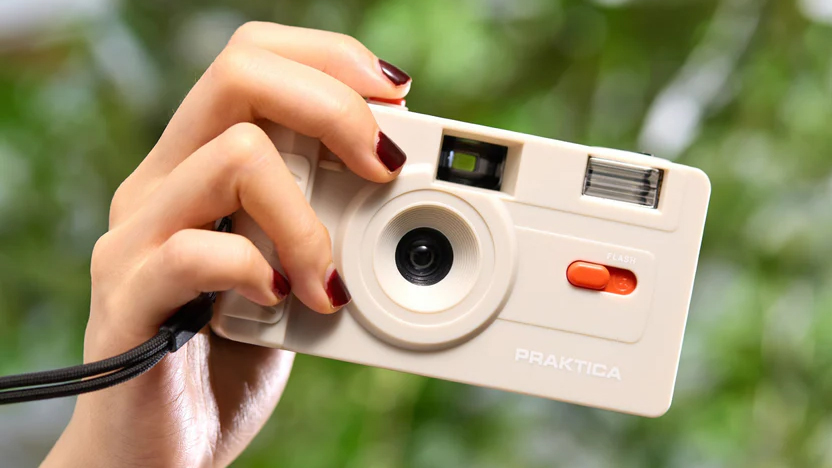 Praktica Reusable 35mm Film Camera being handheld outdoors