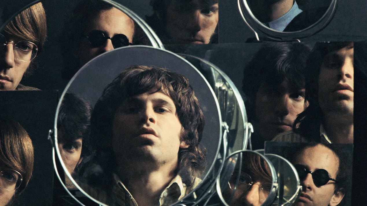 Ray Manzarek stands in front of the grave of Jim Morrison, surrounded  News Photo - Getty Images