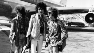 Popular rock trio the Jimi Hendrix Experience at London Airport with their hand luggage. They are, from left to right; Noel Redding (1945 - 2003), bass player, Jimi Hendrix, singer, guitarist and songwriter, and Mitch Mitchell, drummer.