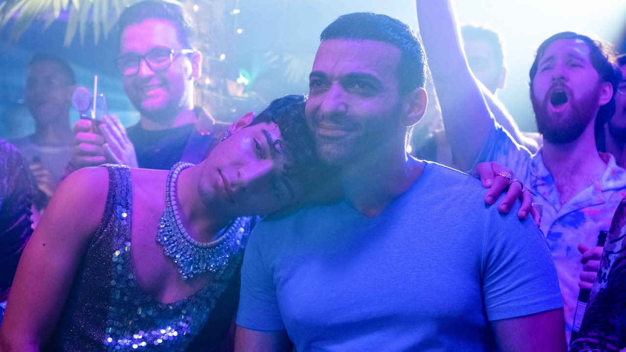 Adam Ali and Haaz Sleiman leaning on each other while in gay club in “Little America,” Season 1 episode "The Son"