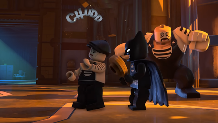 lego batman screenshot showing him bopping someone on the head with a frying pan