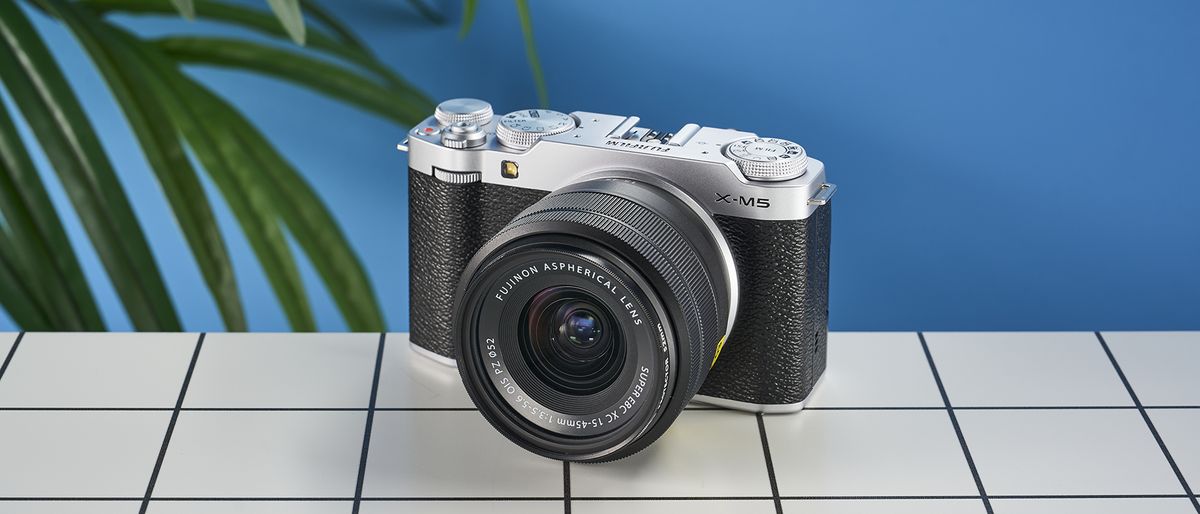 A Fujifilm X-M5 mirrorless vlogging camera in the silver colorway