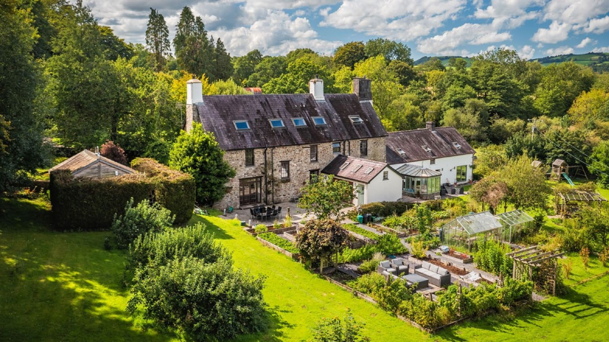 A 17th century farmhouse surrounded by gardens in Carmarthenshire.