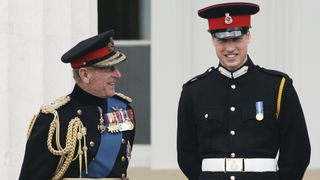 Prince William in uniform as an officer cadet, chats with his grandfather Prince Philip, Duke of Edinburgh