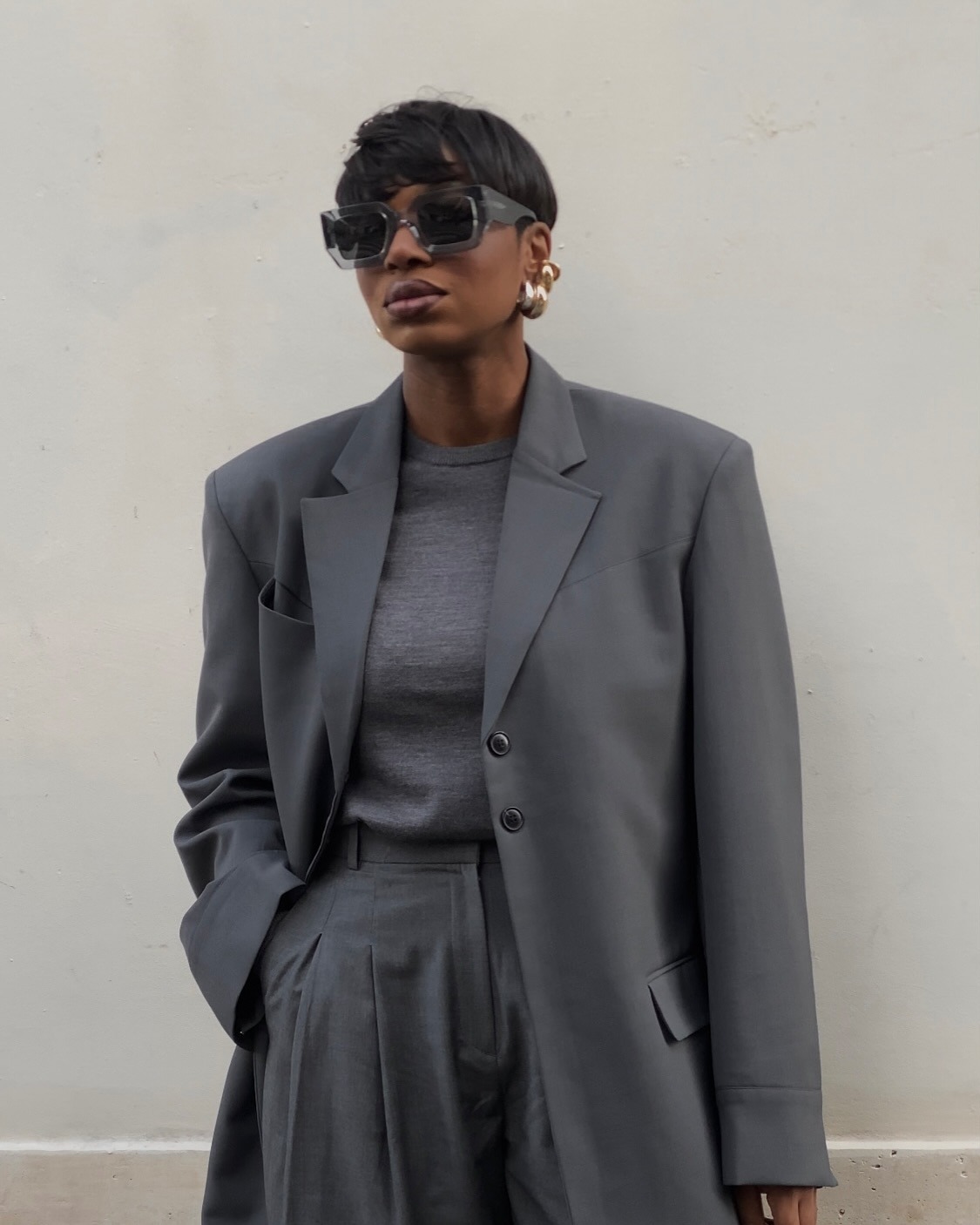 Woman wearing oversize blazer in street style shot.