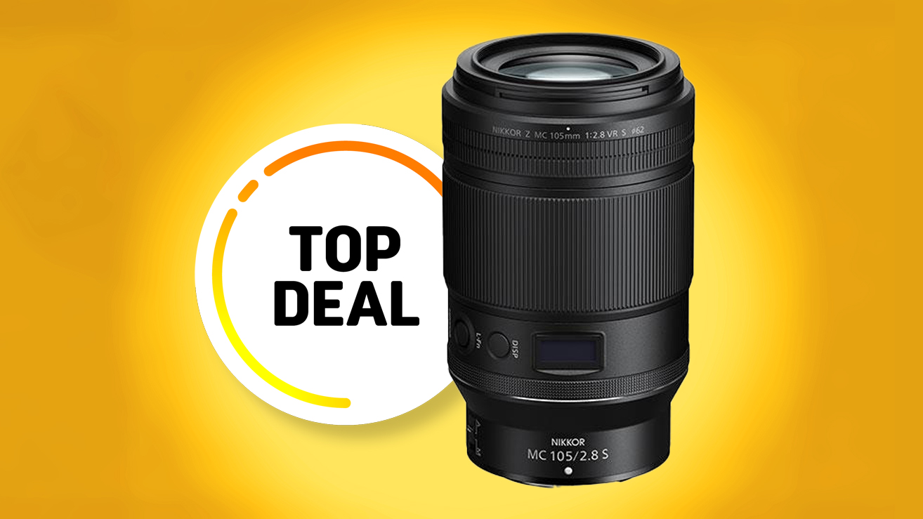 Nikon Z MC 105mm f/2.8 VR S lens on a bright yellow background with &quot;Top Deal&quot; graphic promoting a special offer