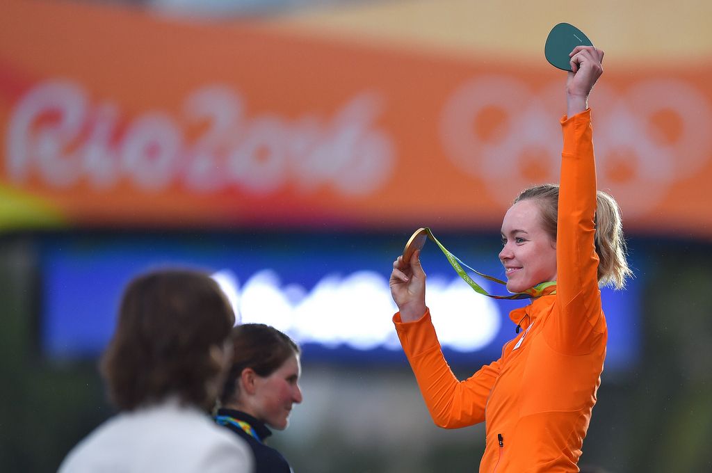 Anna van der Breggen (Netherlands) shows off her gold medal to the crowd
