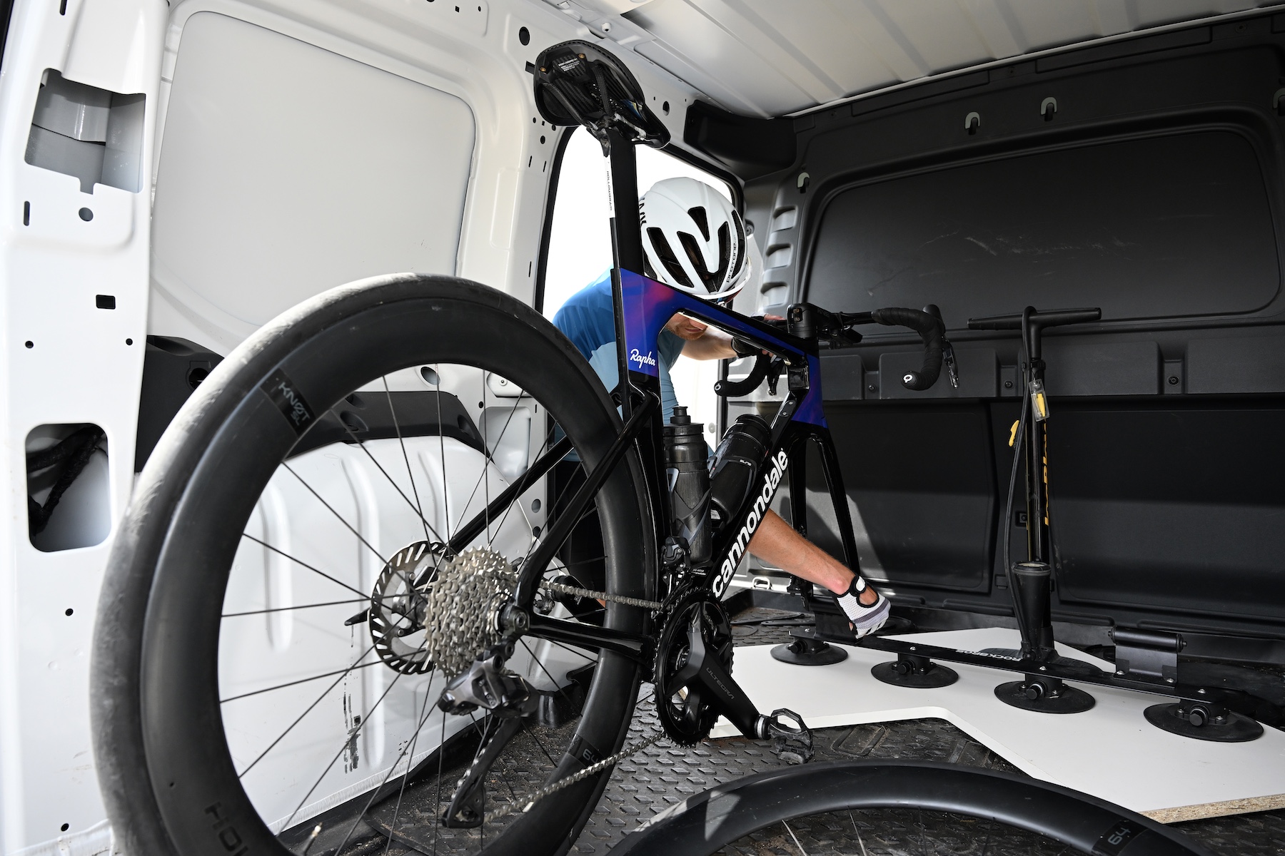 Rider securing his bike in back of his van