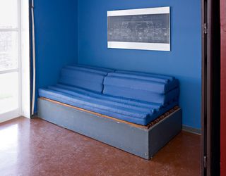 A bed/sofa, designed to fit specifically into the main sitting room space