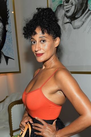 Tracee Ellis Roos pictured with a curly bun at the Art with a Cause on July 27, 2017 in Los Angeles, California.