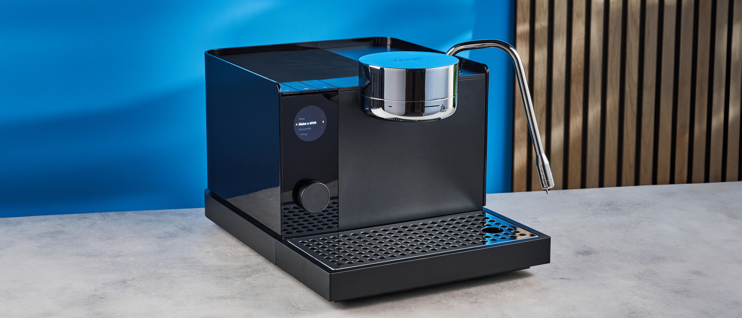the fellow espresso series 1 photographed against a blue tom's guide background showing espresso, LCD smart screen, steam wand