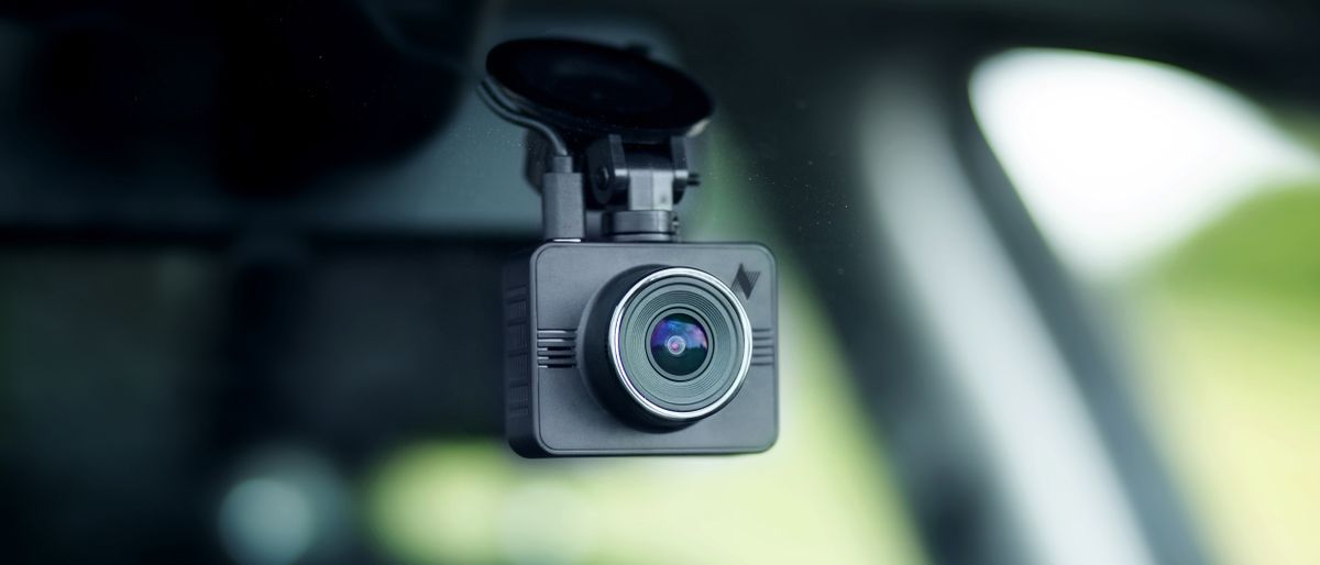 A dash camera inside a car windscreen