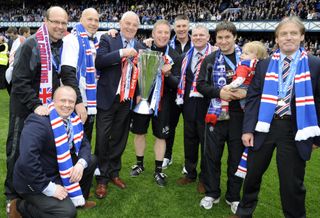 Walter Smith, centre left, and Ally McCoist, centre right, lift the Scottish League Cup