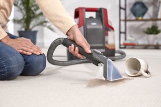 Vax SpotWash Carpet Cleaner cleaning a spillage on carpet