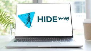 Hide.me VPN logo on a laptop sitting on a desk