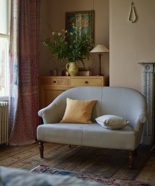 vintage cottage style living room with a small upholstered sofa