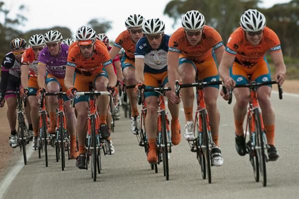 The team of Genesys Wealth Advisers was working hard to bring the break back for their tour leader Joel Pearson (purple) before the race hit the main street of Manangatang.