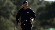 Phil Mickelson celebrates holing a putt at The Masters