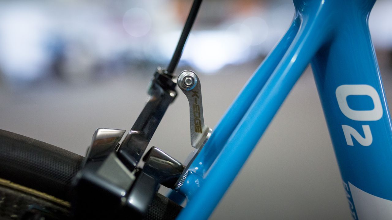 A neat number plate mount from K-Edge sits on the rear brake mount