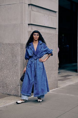 Sophia Roe at new york fashion week in light wash jeans, a denim trend, and mary jane flats