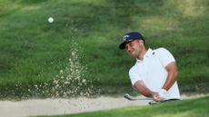 Xander Schauffele of the United States plays a shot from a bunker on the 14th holeduring the first round of the 2024 PGA Championship at Valhalla Golf Club