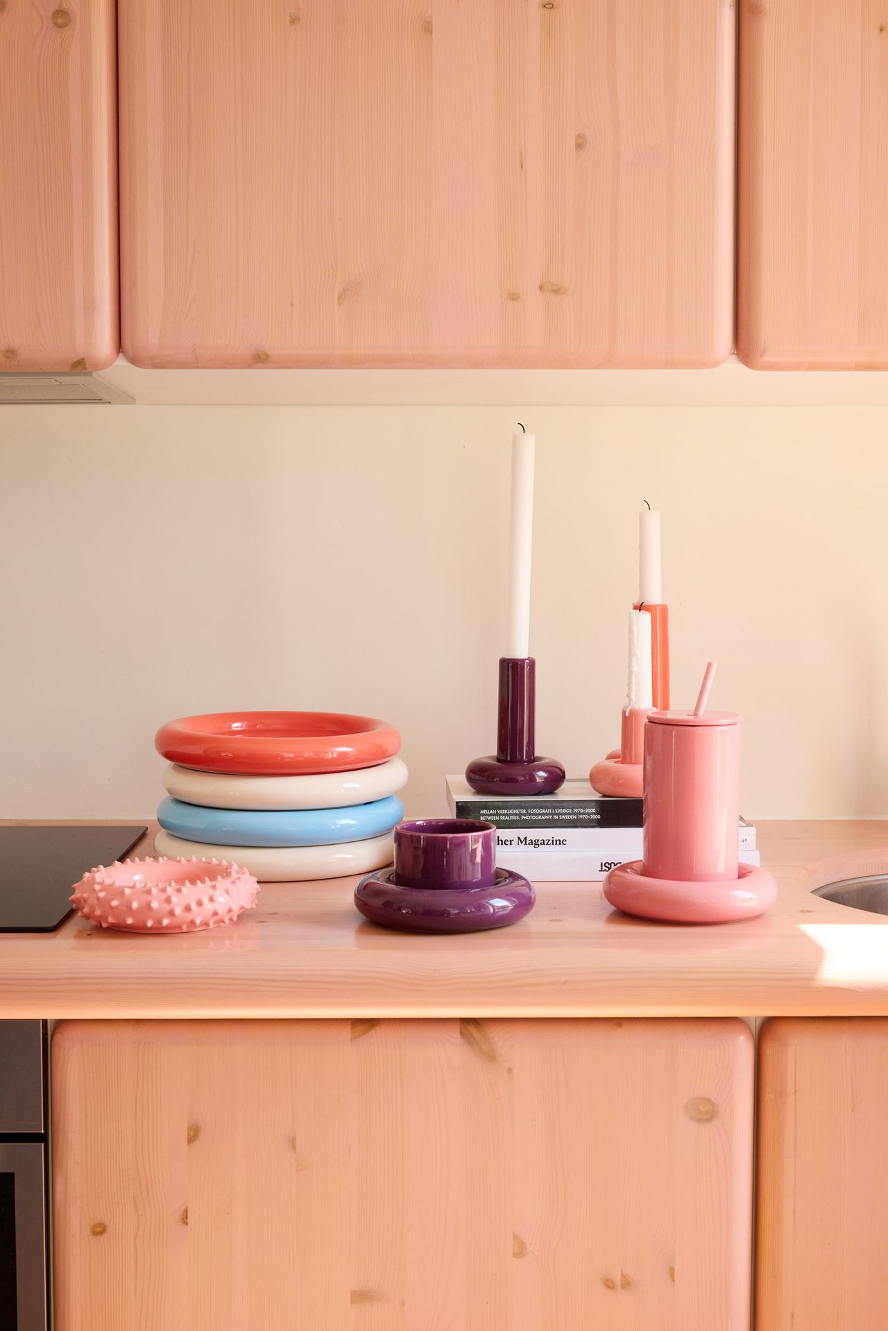 A series of whimsically shaped, pastel-shaded objects with a chunky feel sits in a Scandinavian studio flat with an irreverent atmosphere.