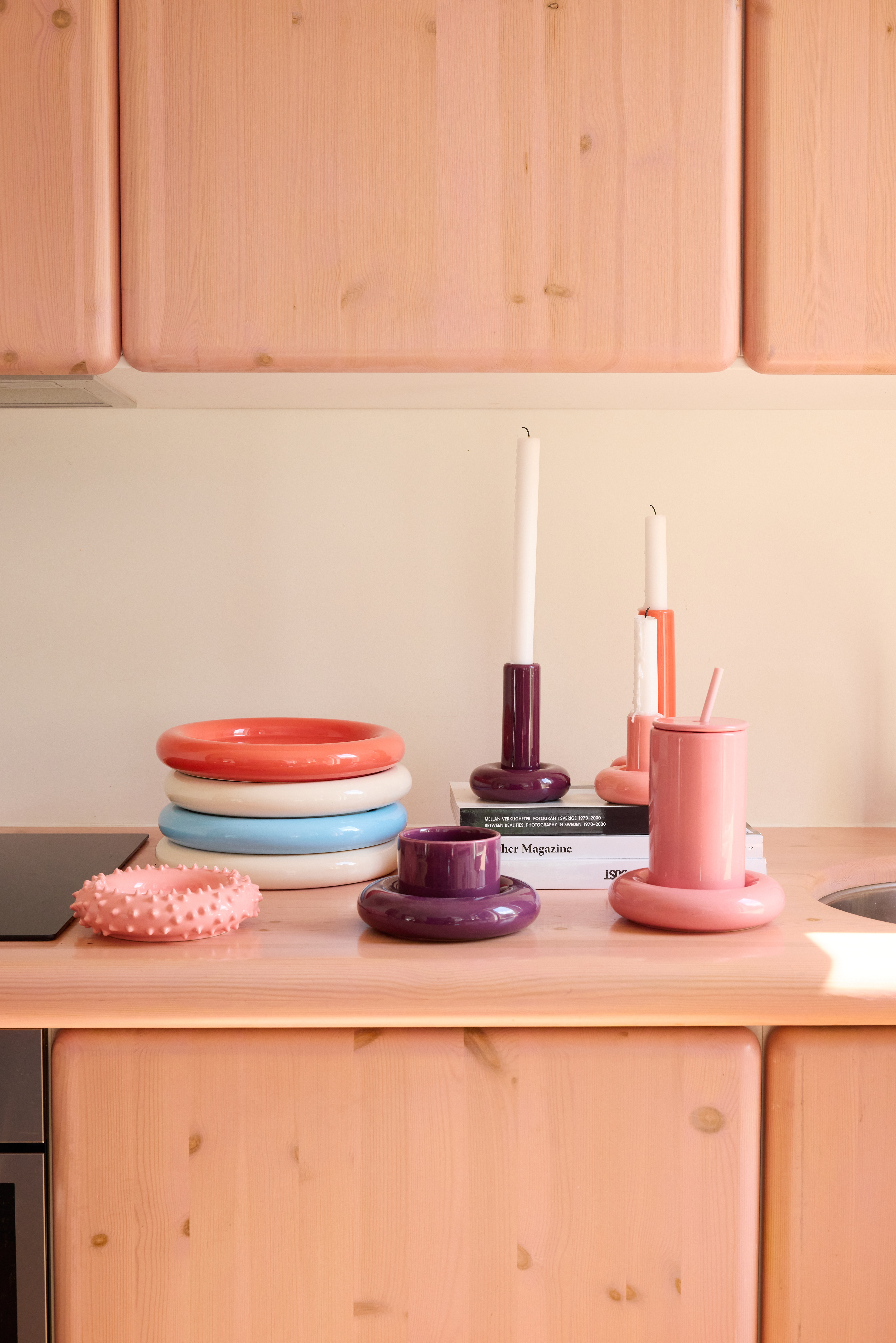 A series of whimsically shaped, pastel-shaded objects with a chunky feel sits in a Scandinavian studio flat with an irreverent atmosphere.