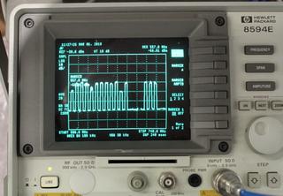 Multiple closed-circuit UHF television channel RF paths were necessary for the testing. They're shown here on a spectrum analyzer that was part of the test gear deployed for the five-day Plugfest event.