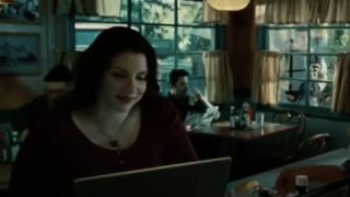 Stephanie Meyer as a restaurant patron sitting with her laptop in Twilight