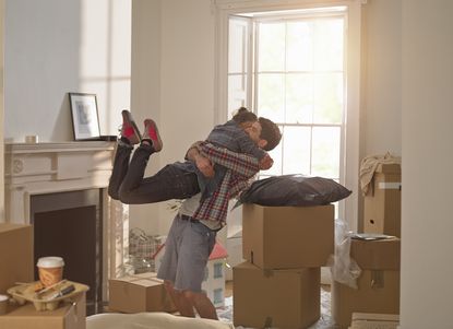 A couple celebrating moving in to a new home