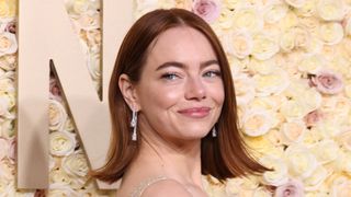 Emma Stone is seen with copper hair at the 81st Annual Golden Globe Awards at The Beverly Hilton on January 07, 2024 in Beverly Hills, California.