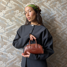 Anne-Victorie wearing a black blazer and head scarf