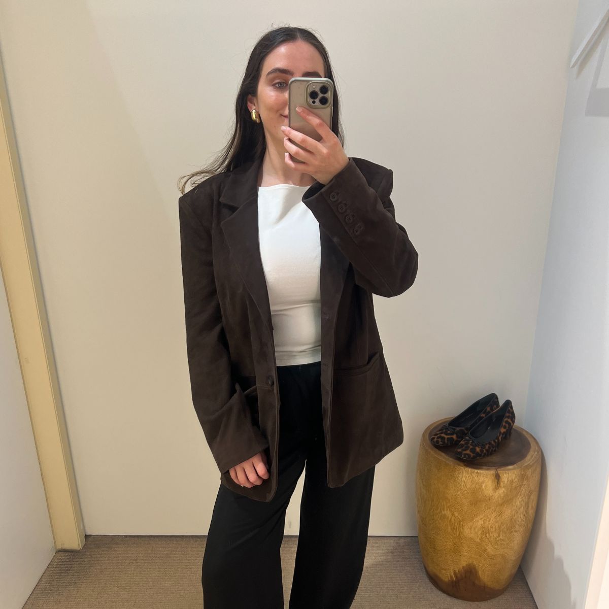 Who What Wear UK editor wears Reformation's Mason pants as part of a news story rounding up the best Reformation Black Friday deals in 2025.