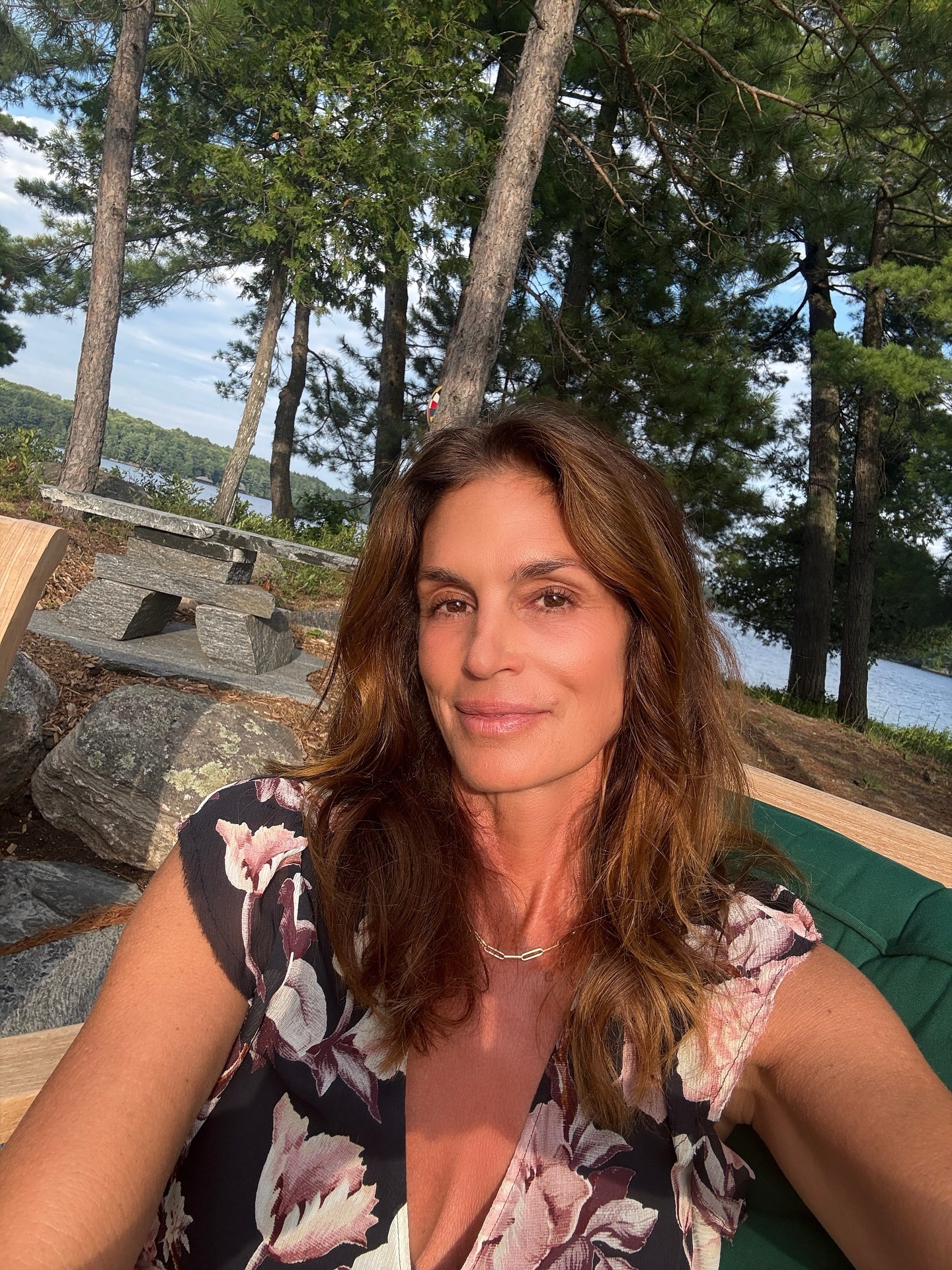 Cindy Crawford taking a selfie with warm brunette hair