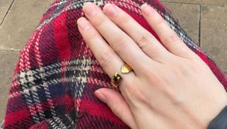 Evie smart ring being worn on an index finger