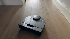 robot vacuum on oak floor
