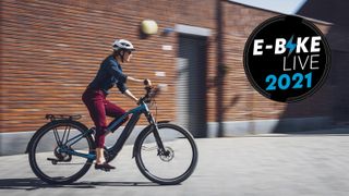 Woman riding a Shimano ebike in an urban environment