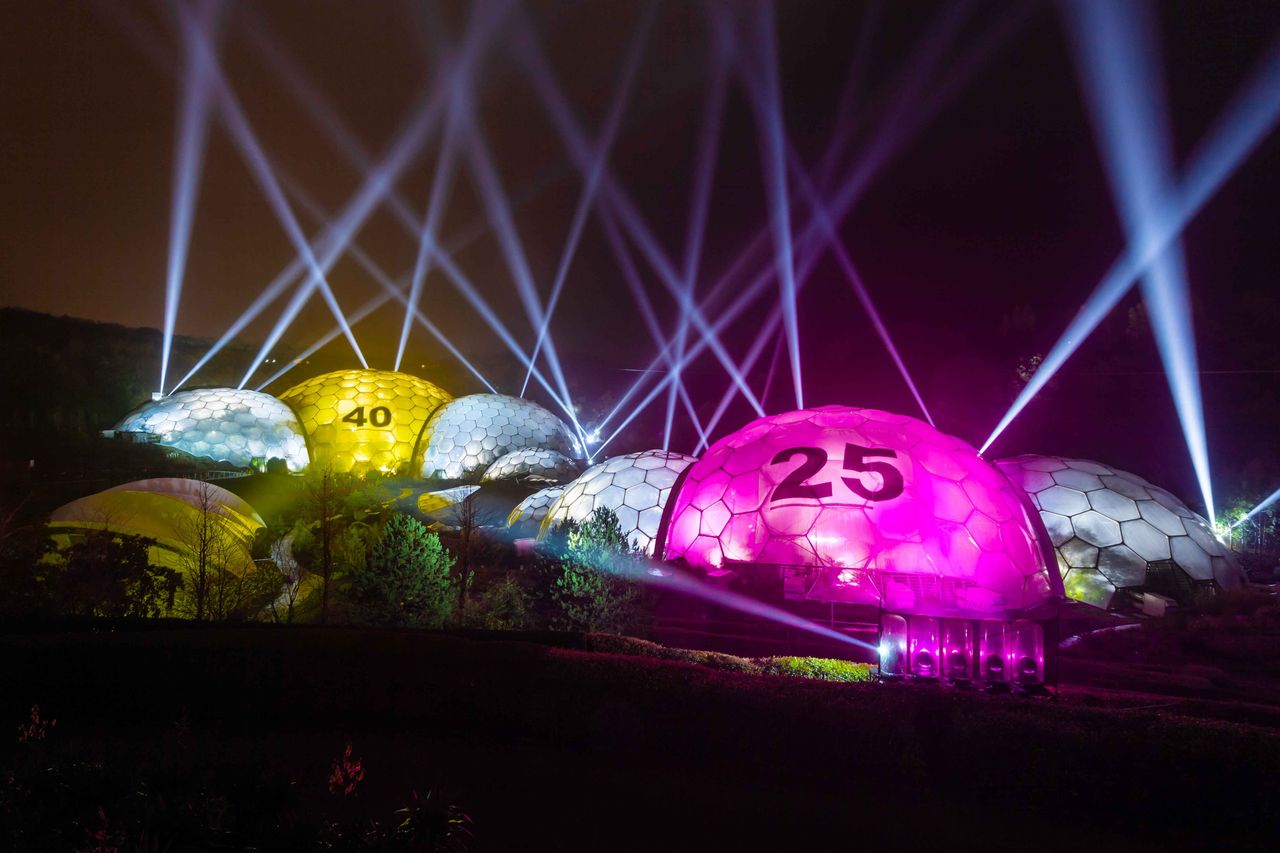 A night time view of the Eden Project Biomes lit as giant National Lottery balls