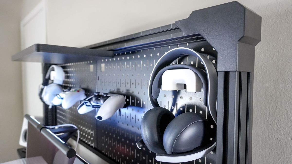 Corsair's Multi Frame Pegboard Desk Organizer with various gaming headsets and controllers stored at the top