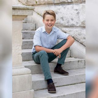 Prince George posing on steps for his tenth birthday portrait