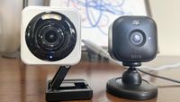 Wyze Cam 4 on table side by side with the Blink Mini 2 security camera